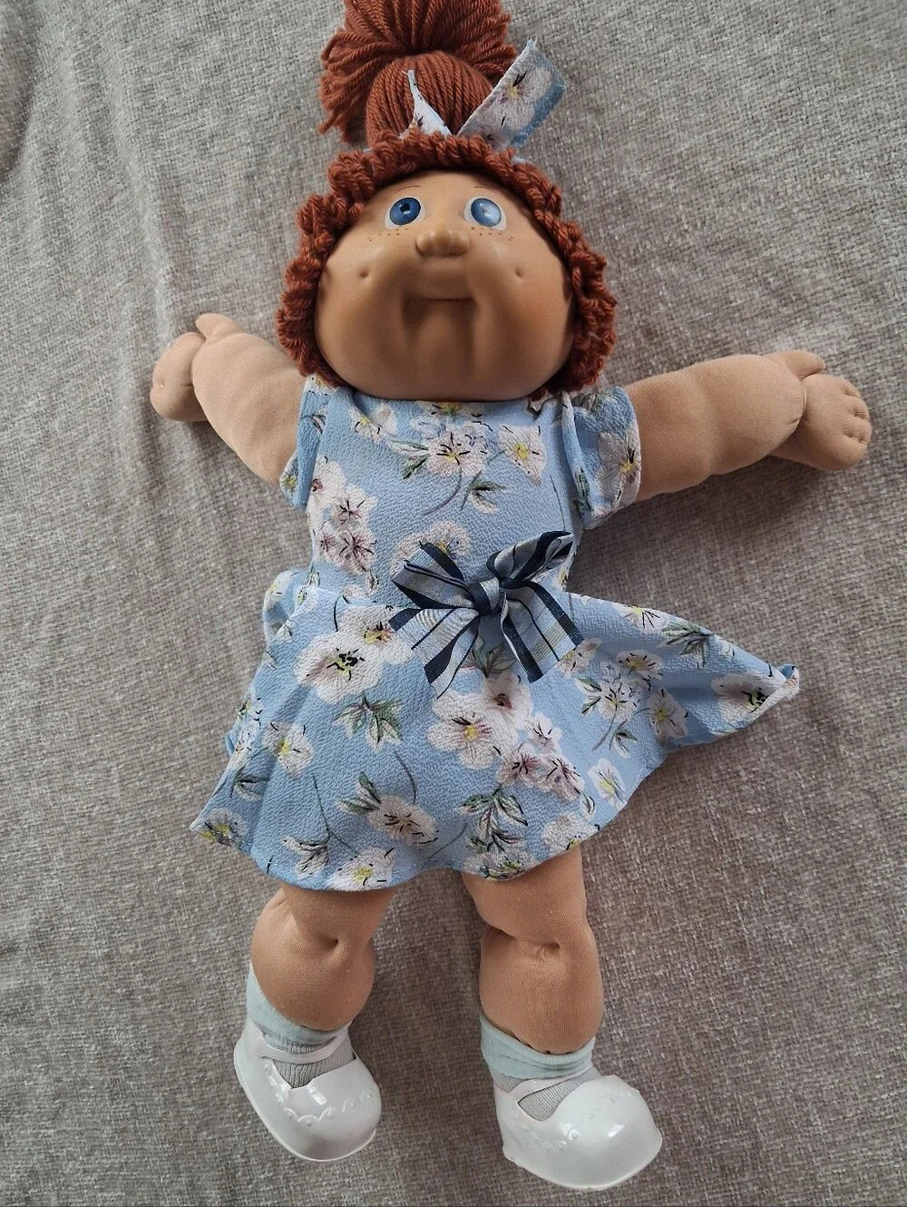 Plush Baby Doll with Blue Floral Dress and Curly Red Hair